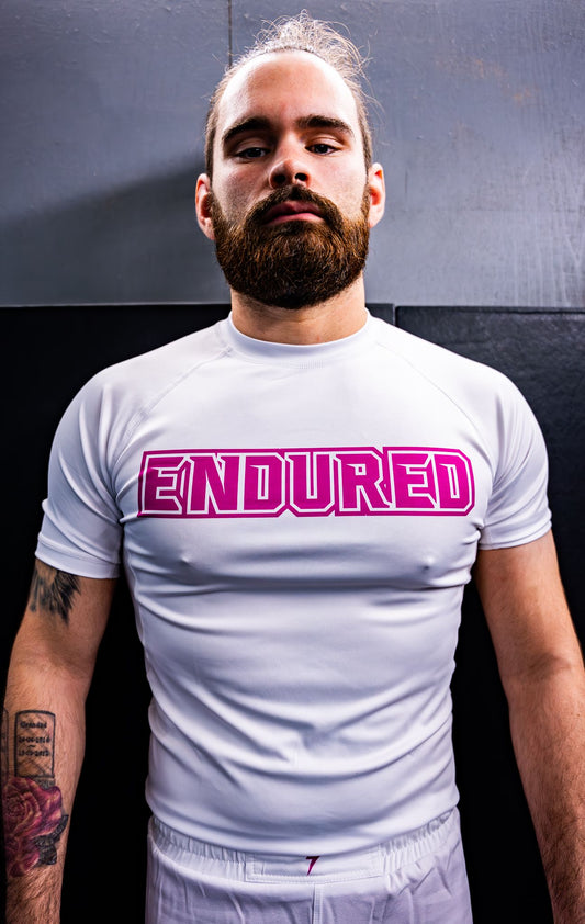 Pink on white logo rashguard