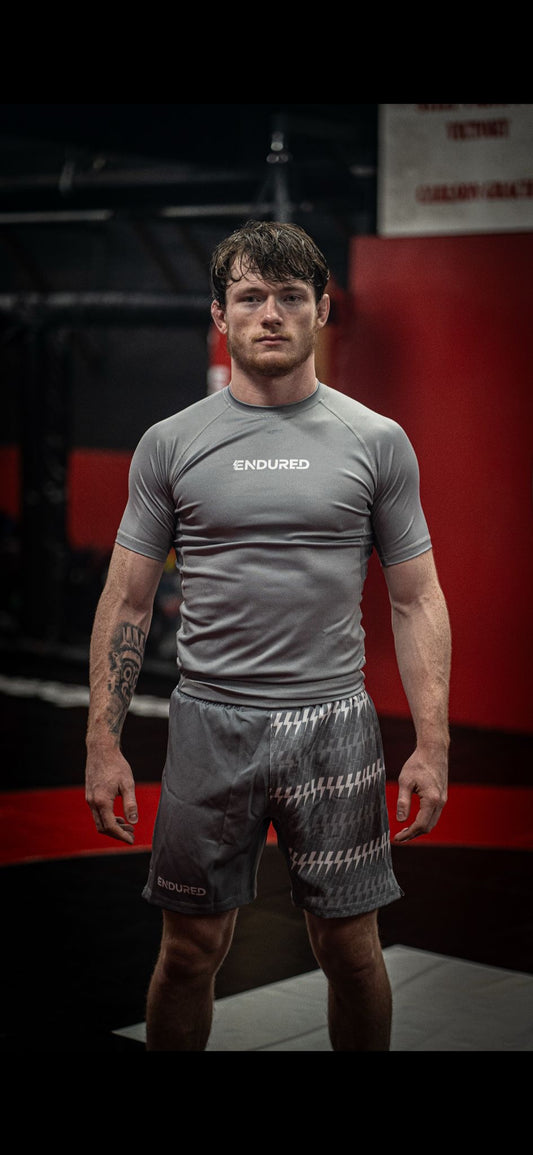 Grey repeated lighting bolt rashguard